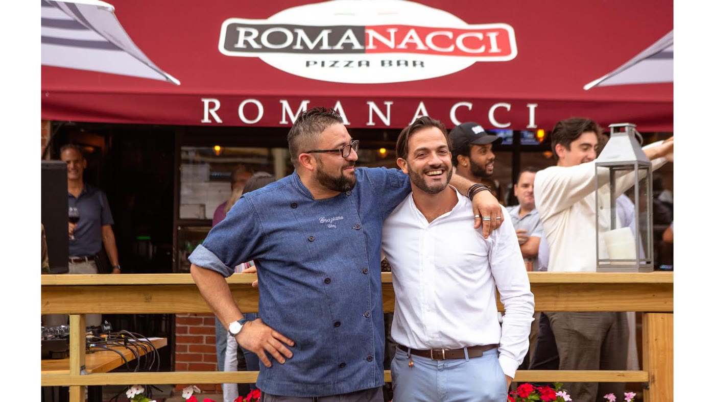 The Romanacci chef and owner together under the pizza bar awning on opening night