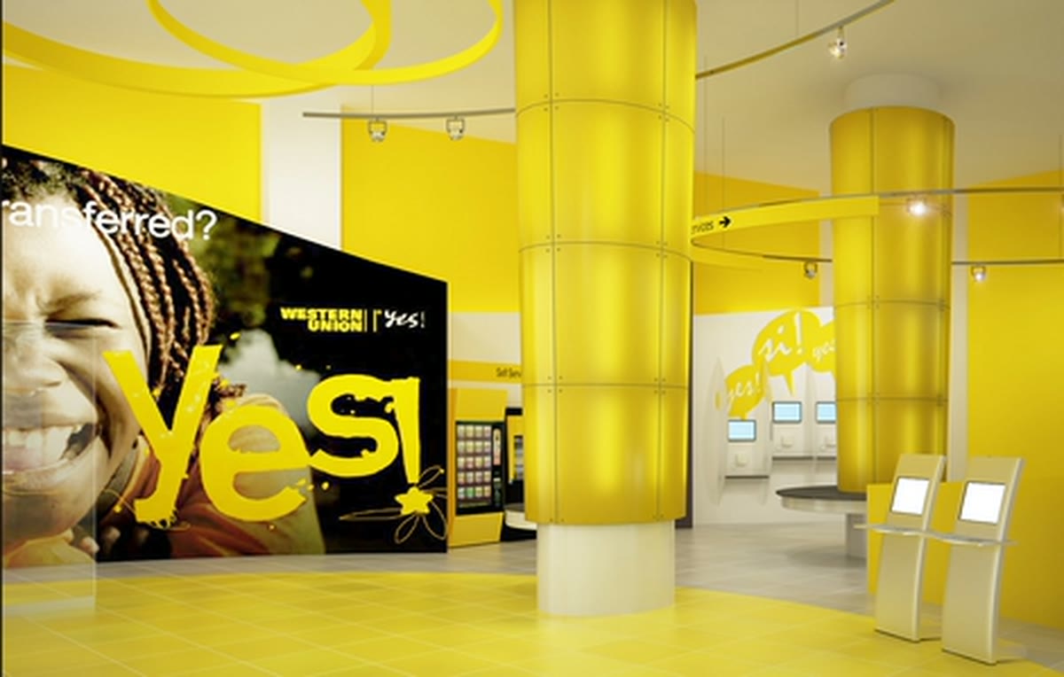 A Western Union storefront in Times Square at night